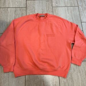 Essentials by Fear Of God oversized crewneck sweater in Coral